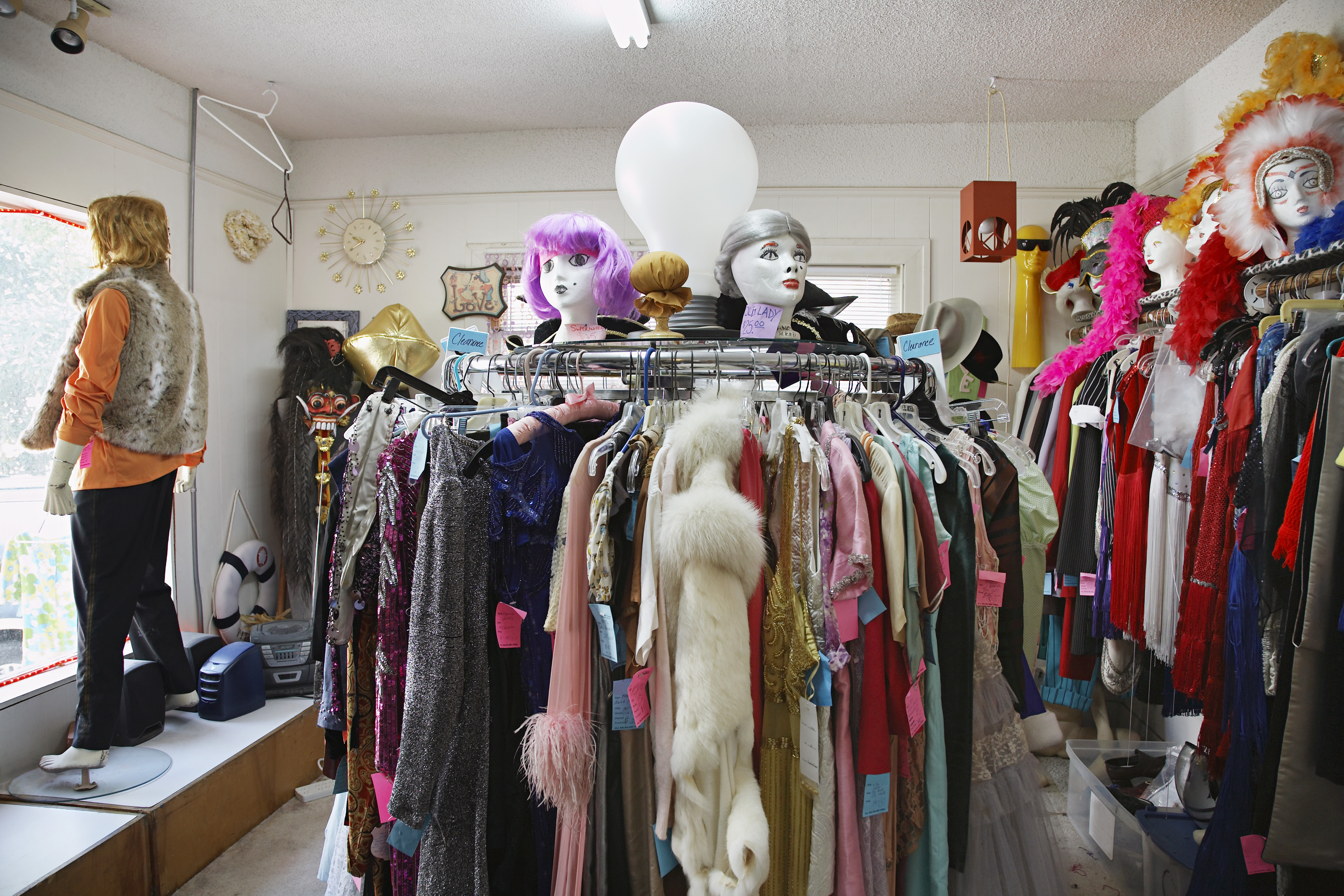 Thrift Store Photo 1 Clothing and wigs in crowded thrift store