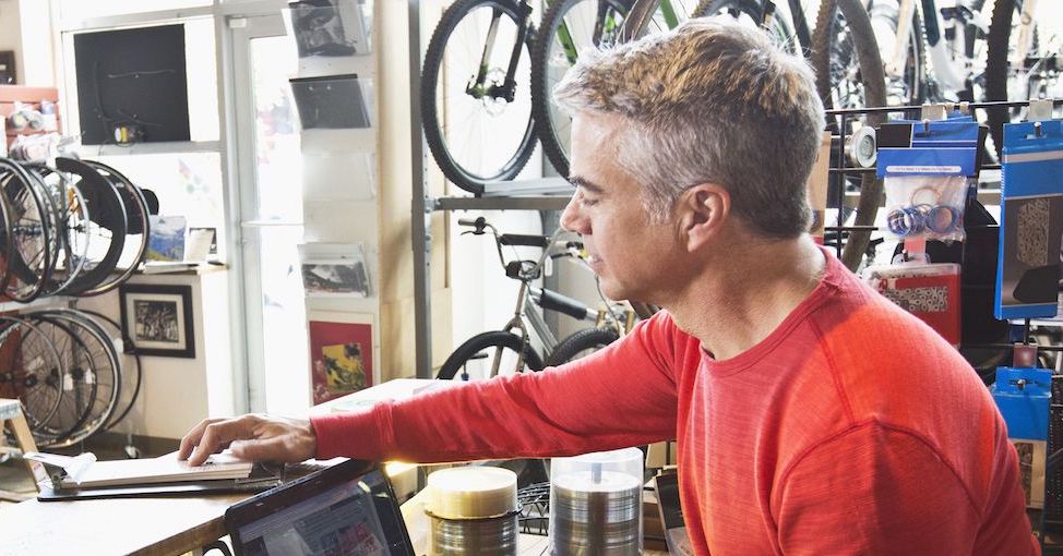Man at checkout in sporting goods store