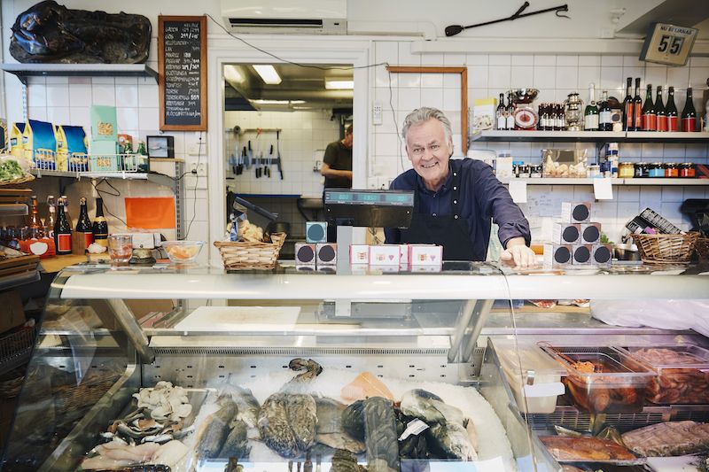 Liquor & Grocery Specialty Grocery dark pic Clerk in specialty grocery store
