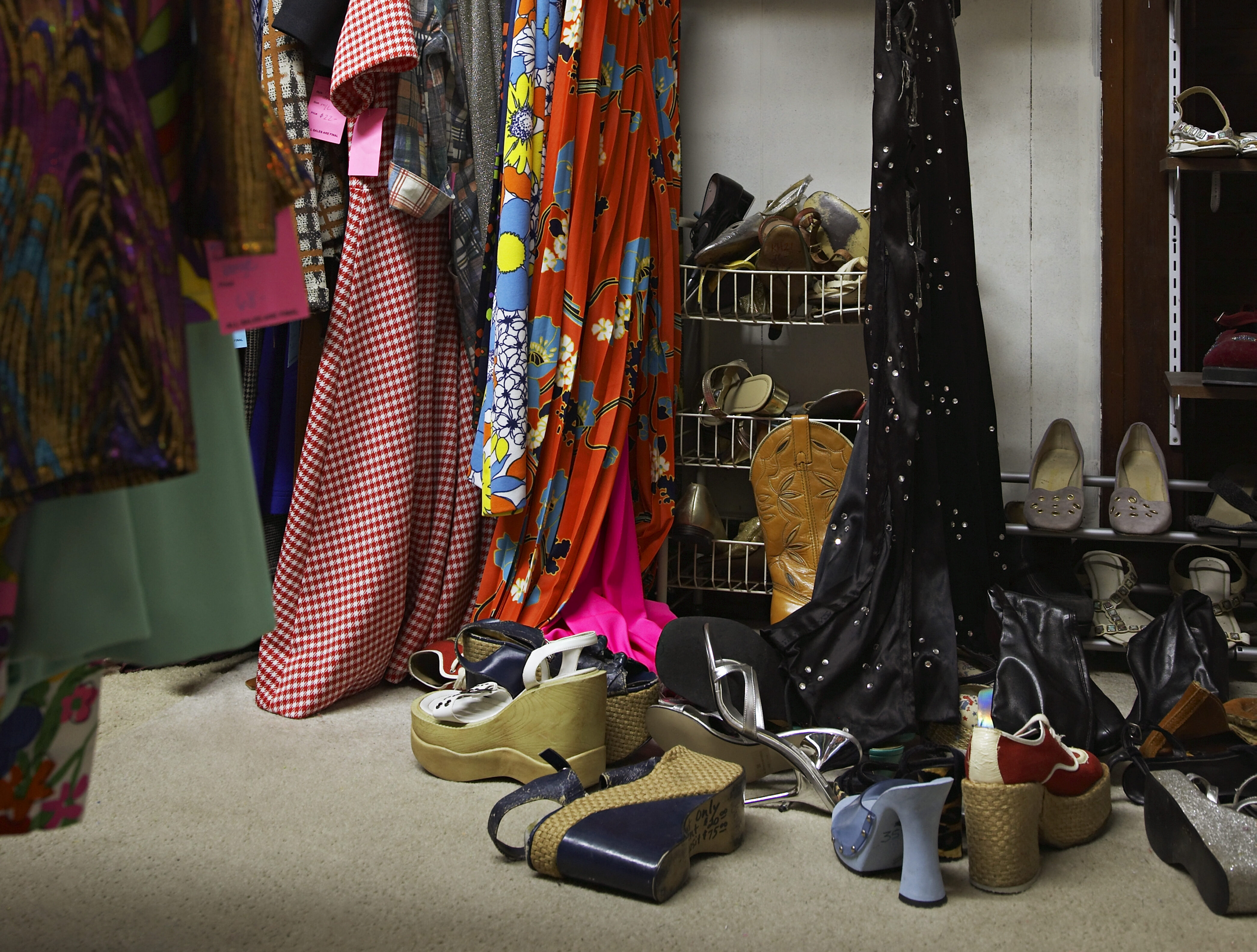 Thrift Store Photo 2 Crowded clothing racks and piled shoes in thrift store